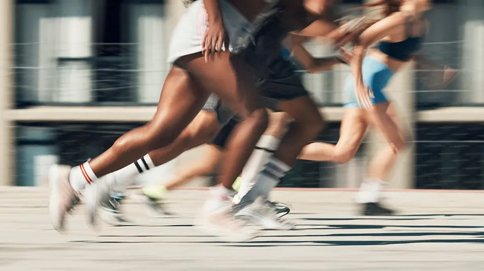 People running in the park during the day.